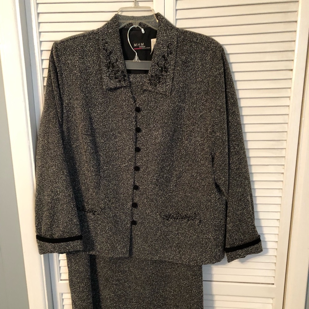 Grey tweed suit, skirt knee length. Very comfy